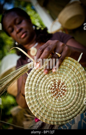 Barbara Manigault, a Gullah sweet grass basket weaver at her stand in Mt Pleasant, SC.  Stock Photo