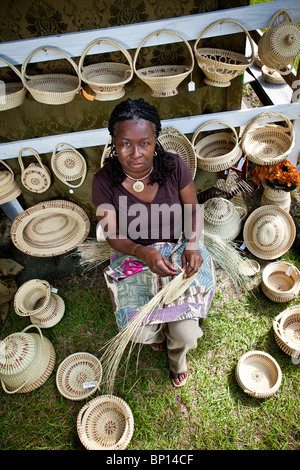 Barbara Manigault, a Gullah sweet grass basket weaver at her stand in Mt Pleasant, SC. Stock Photo