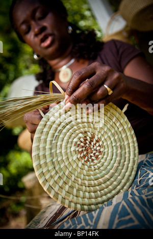 Barbara Manigault, a Gullah sweet grass basket weaver at her stand in Mt Pleasant, SC.  Stock Photo