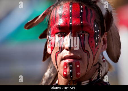 a native of Lac-Simon indian Reservation and wearing Algonquin traditional dresses and paint Stock Photo