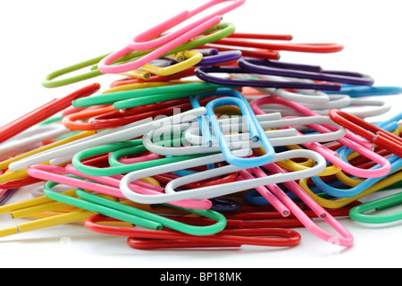 Close-up photograph of a pile of colorful paper clips isolated on a white background. Stock Photo