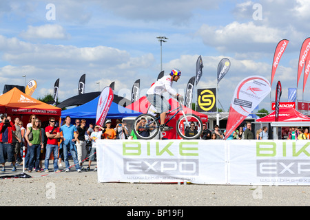 World Champion Trial Biker Petr Kraus at the Bike Expo in Munich showing some of his tricks. Stock Photo
