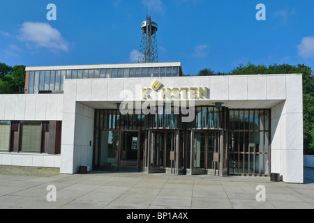 Kunsten Museum of Modern Art in Aalborg Denmark with Aalborgtaarnet (The Aalborg Tower) in the background Stock Photo