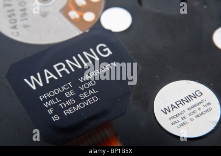 Label on the outside of a hard disk drive 'Warning. Product warranty will be void if this seal is removed' Stock Photo