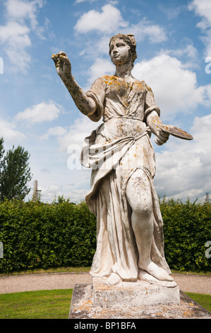 Statue of a woman in a formal garden Stock Photo