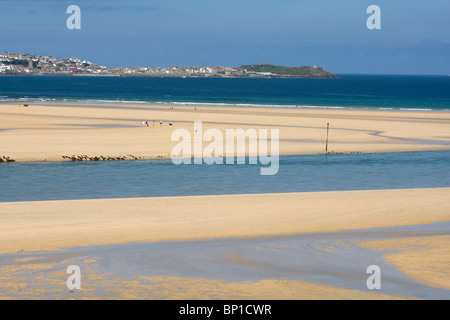 The beach at Hayle, St Ives Bay, Cornwall with St Ives in the background. Stock Photo