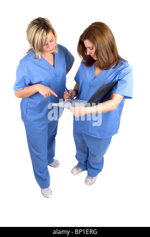 Two Hospital Nurses Checking Patient Records Stock Photo