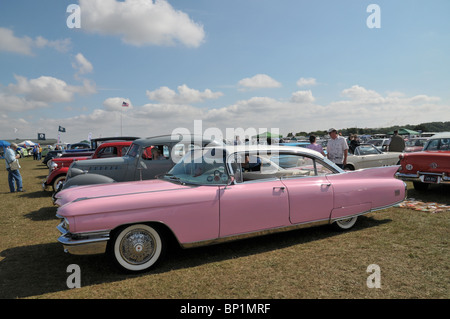 a pink cadillac on show with other classic cars at the steam rally kemble 2010