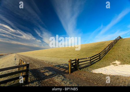 An open fence at the Waddensea dike Stock Photo