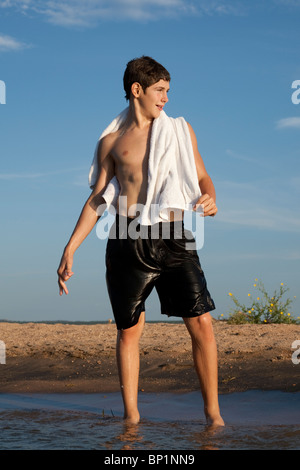 13 year-year-old Anglo boy poses in the water of Lake Buchanan in Llano County, TX. Part of a series. Model Released. Stock Photo