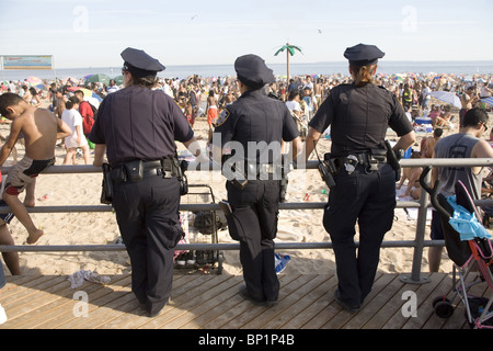 Three female NYPD cops on the beat on the Boardwalk at Coney Island, Brooklyn, NY.