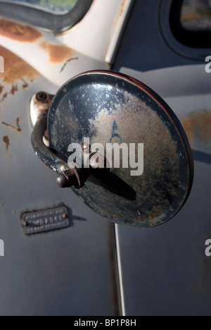 Manually adjustable driver's side door mirror from a mid-1950's (1953-57) Chevrolet pickup truck. Stock Photo