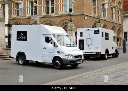 Side and back view of Loomis cash & valuables transport vans a business company operating high security armoured transportation in London England UK Stock Photo