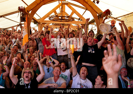 Watching the Engalnd vs. Germany football game from the world cup at Glastonbury Festival, Somerset, UK. Stock Photo