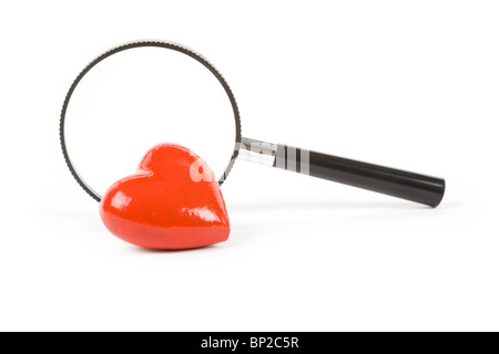 Red Heart and magnifier, concept of searching love, Healthy Life Stock Photo