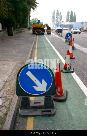 UK, England, Cheshire, Stockport, Wellington Road, North, traffic delayed in roadworks with cones blocking one lane Stock Photo