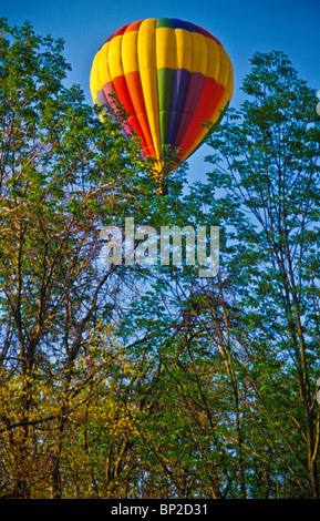 Hot air balloon riders soar , float over Lancaster farm fields Stock Photo