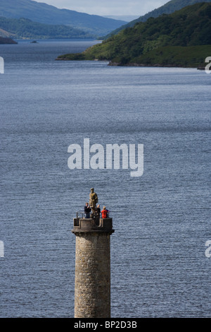 Tourists on Glenfinnan Monument built where Scottish Jacobite Bonnie Prince Charlie first raised his rebel standard in 1745. Stock Photo