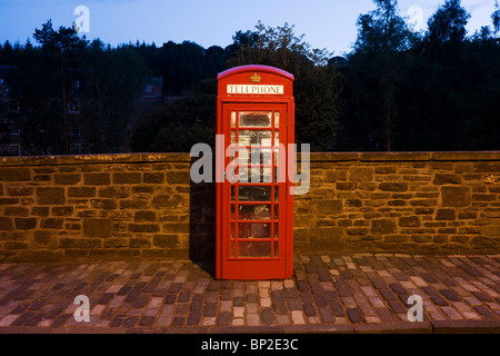 Public phone box at New Lanark, the industrial revolution community village managed by social pioneer Robert Owen. Stock Photo