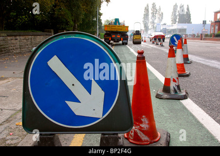 UK, England, Cheshire, Stockport, Wellington Road, North, traffic delayed in roadworks with cones blocking one lane Stock Photo