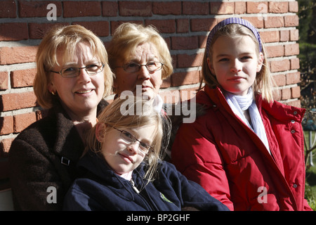Group portrait of grandmother, mother and two daughters, Hamburg, Germany Stock Photo