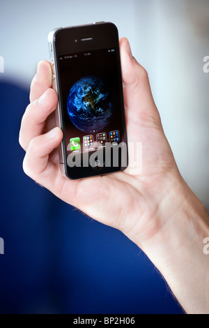 Apple Mac iphone 4g being held in a man's hand Stock Photo