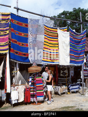 Couple by souvenir stall, Tulum, Quintana Roo State, Mexico Stock Photo