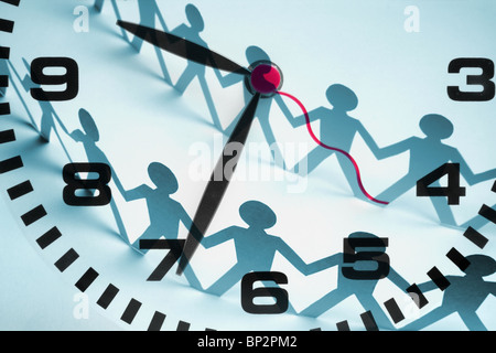 Clock and Paper Chain Dolls Stock Photo