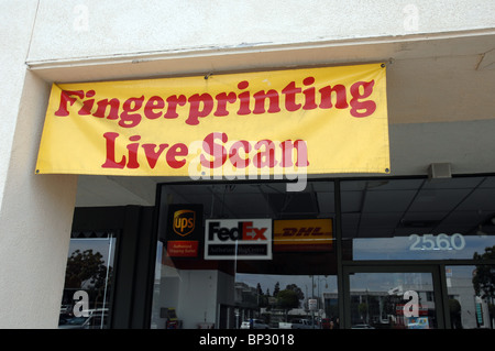 Fingerprinting - Live Scan sign posted at a mailbox and postal annex business. Stock Photo