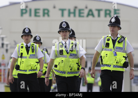 Police officers walk along Bournemouth Pier prior to the Labour Party Conference. Picture by James Boardman. Stock Photo