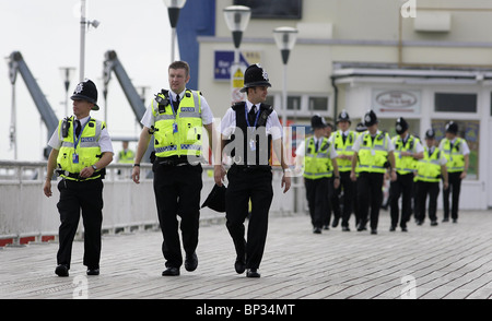 Police officers walk along Bournemouth Pier prior to the Labour Party Conference. Picture by James Boardman. Stock Photo