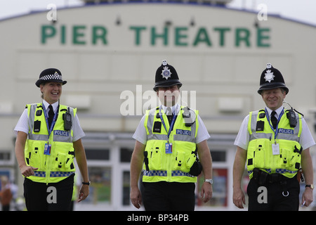 Police officers walk along Bournemouth Pier prior to the Labour Party Conference. Picture by James Boardman. Stock Photo