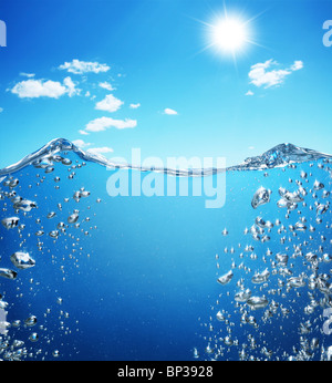 Air bubbles rise from the bottom of the ocean to the surface. Stock Photo