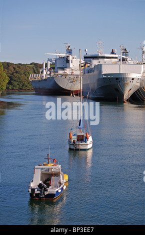 cargo ships laid up in deep water on the river Fal near Truro in Cornwall UK Stock Photo