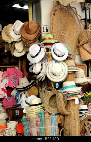 Shop display of handmade straw hats, woven mats, baskets, rugs, bags and other craft items in Nijar Spain Stock Photo