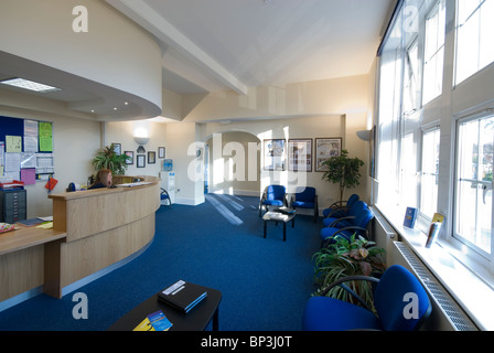 Peter Symonds College reception with high low disabled friendly desk Stock Photo