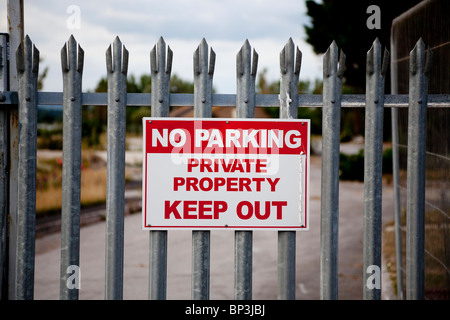 Private Property / No Parking sign on entrance to demolition site Stock Photo