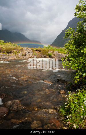 Waterfall over the dark rock in the forest Stock Photo - Alamy