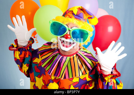 Funny birthday clown in hilarious oversized sunglasses.  Stock Photo