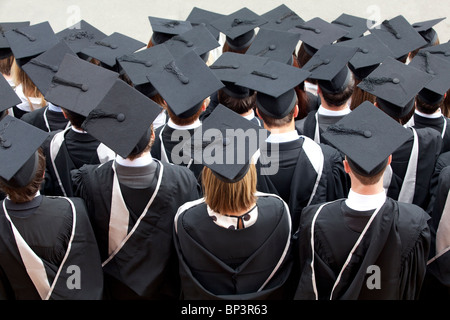 Graduates wait to be photographed after a degree ceremony at Birmingham University in the UK Stock Photo