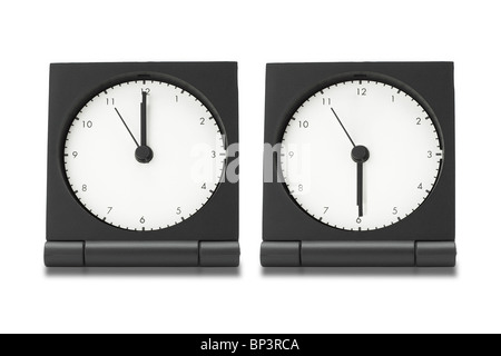 Two alarm clocks isolated on white background Stock Photo - Alamy