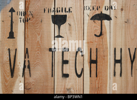 Warning pictograms on a wooden box Stock Photo