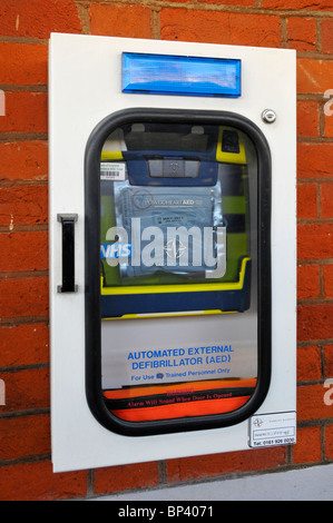 Automated external defibrillator on train station an NHS electronic healthcare device that sends an electric shock to assist heart attack recovery UK Stock Photo