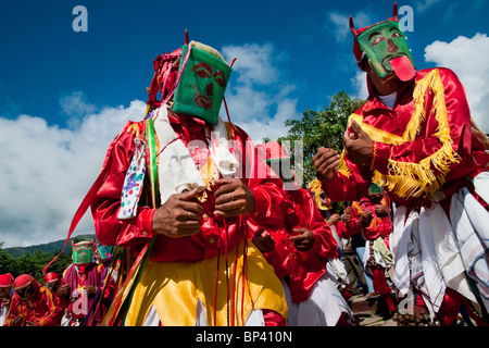 The Devils (Diablos) dance and playing castanets during the religious procession in Atanquez, Sierra Nevada, Colombia. Stock Photo