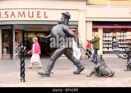Statues of Desperate Dan, dog and Minnie the Minx in the pedestrian area of Dundee. Stock Photo