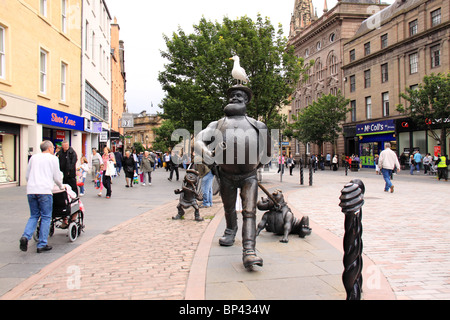 Statues of Desperate Dan, dog and Minnie the Minx in the pedestrian area of Dundee. Stock Photo