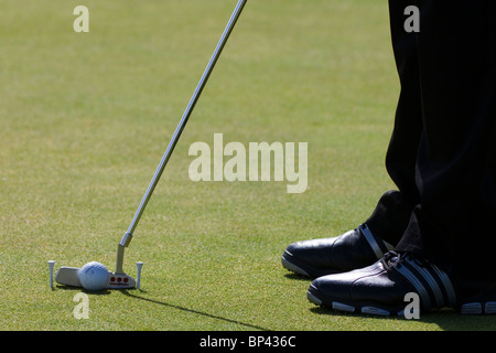 Putting practice using two golf tees as guides, Kilmarnock Barassie Golf course, Troon, Ayrshire, Scotland Stock Photo