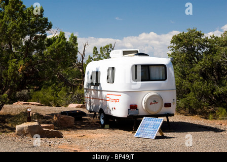 A solar panel is used to supply electricity for a small camping trailer in Colorado National Monument. Stock Photo