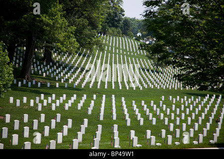 American flags line each gravestone in remembrance of soldiers killed in battle on Memorial Day in Arlington National Cemetery. Stock Photo