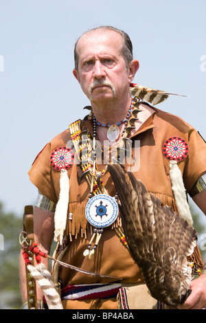 A Native American man dances in traditional regalia at the 8th Annual Red Wing PowWow in Virginia Beach, Virginia. Stock Photo